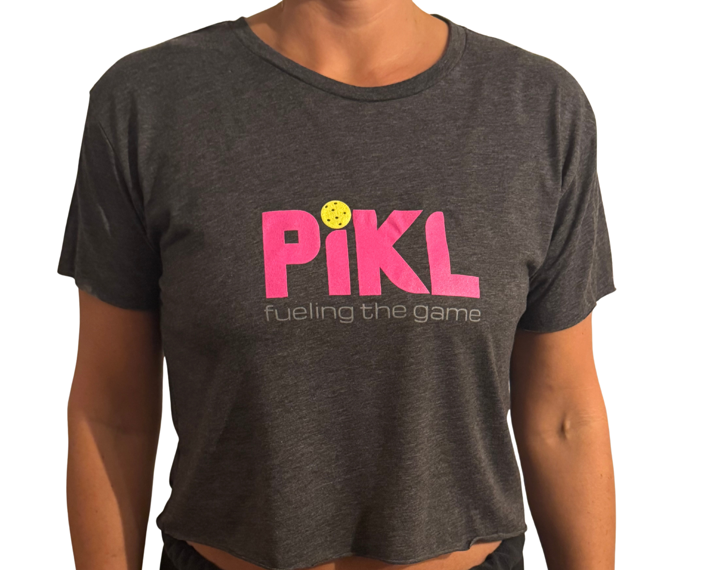 Person wearing a dark gray t-shirt with 'Pikl' logo and text on a white background